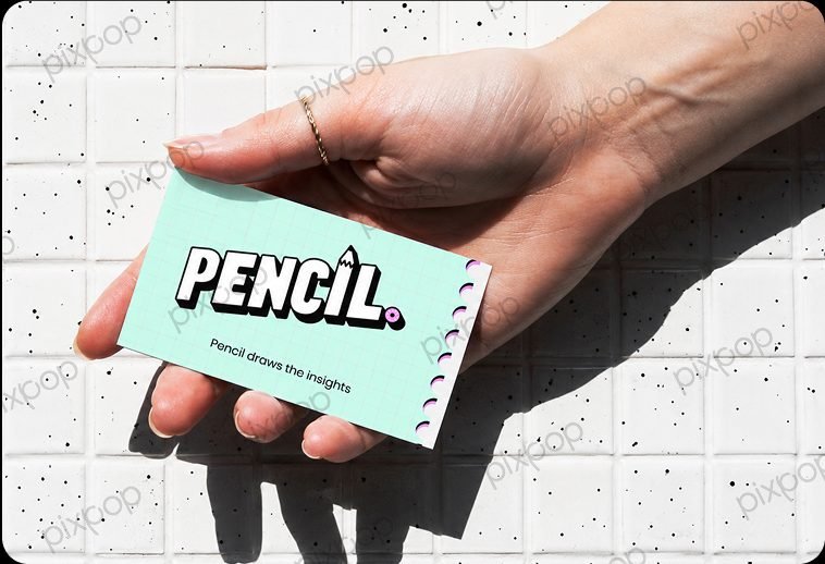 Pencil brand mint green business card held in hand